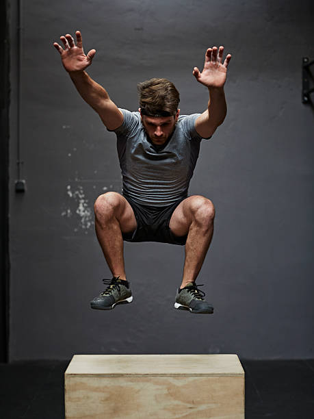 gym jumping on box in gym